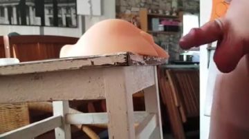 He uses a table to masturbate