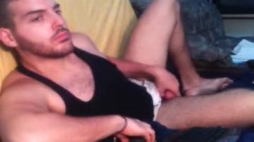 Good-looking guy fiddles with cock