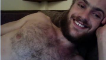 Bearded man jerking off his cock in cam show